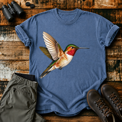 Ruby-Throated Hummingbird Flight Tee in Blue Jean, centered front design on a birdwatching flat-lay mockup