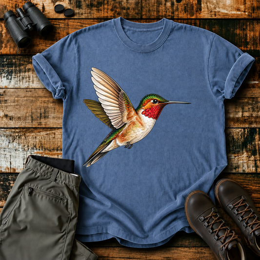 Ruby-Throated Hummingbird Flight Tee in Blue Jean, centered front design on a birdwatching flat-lay mockup