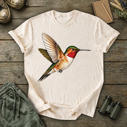 Ruby-Throated Hummingbird Flight Tee in Ivory, centered front design on a birdwatching flat-lay mockup