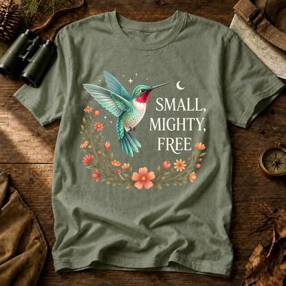 Small Mighty Free Hummingbird Tee in Bay, centered front design on a birdwatching flat-lay mockup