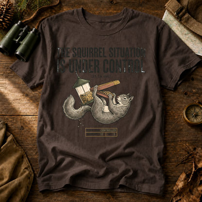 Squirrel Situation Under Control Tee in Espresso, centered front design on a birdwatching flat-lay mockup