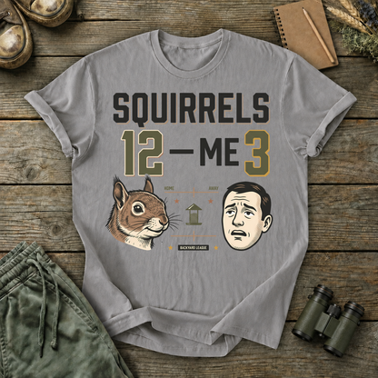 Squirrels 12 Me 3 Backyard Tee in Grey, centered front design on a birdwatching flat-lay mockup