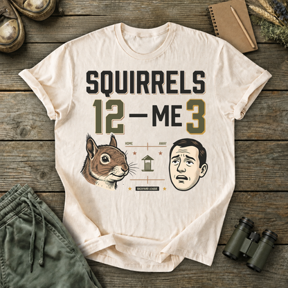 Squirrels 12 Me 3 Backyard Tee in Ivory, centered front design on a birdwatching flat-lay mockup
