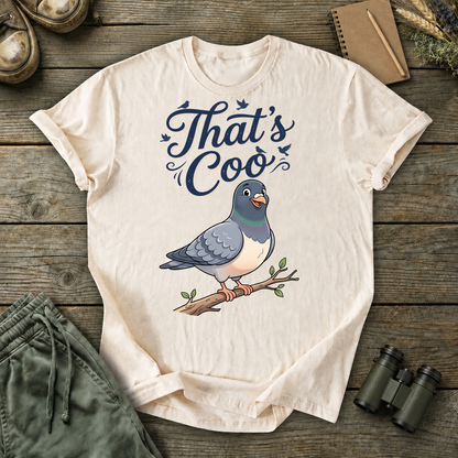 That's Coo Pigeon Tee in Ivory, centered front design on a birdwatching flat-lay mockup