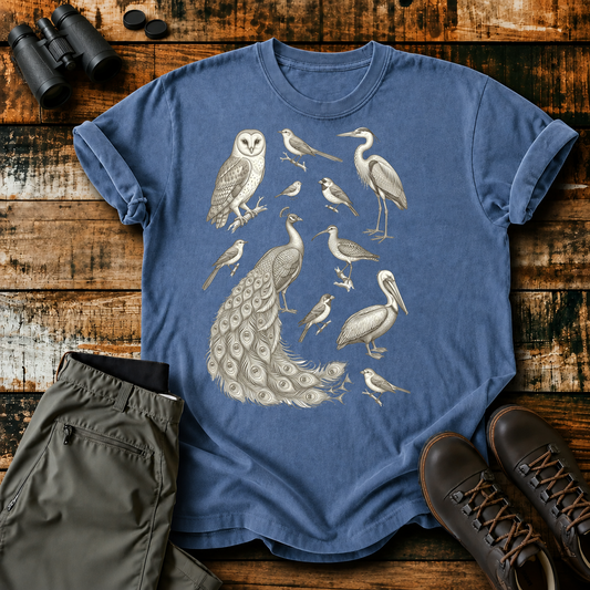 Vintage Field Guide Bird Collection Tee in Blue Jean, centered front design on a birdwatching flat-lay mockup