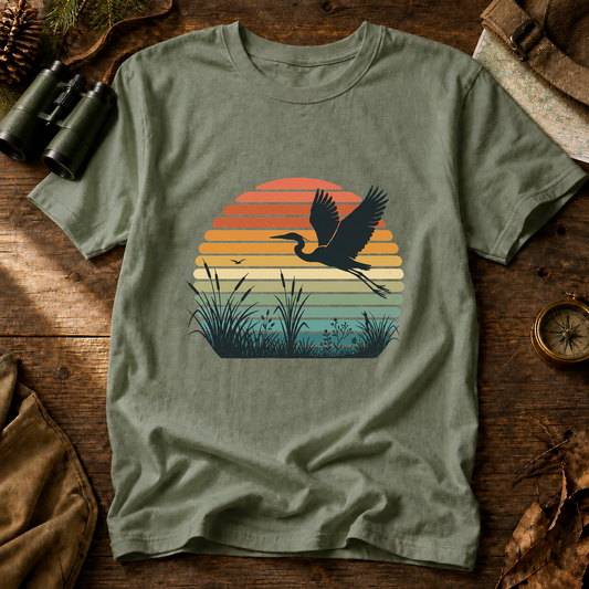 Vintage Sunset Marsh Bird Tee in Bay, centered front design on a birdwatching flat-lay mockup
