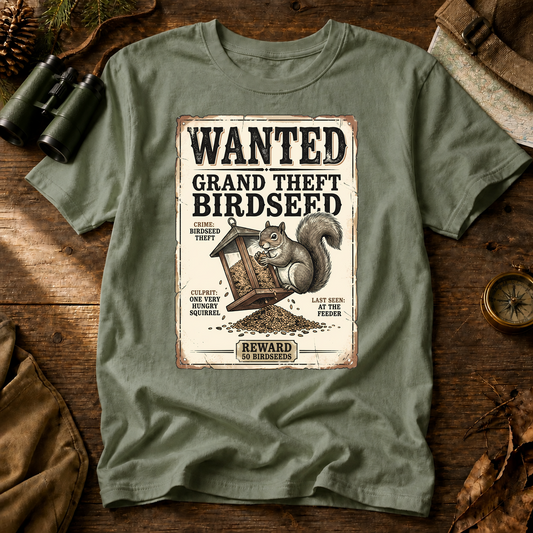 Wanted Grand Theft Birdseed Squirrel Tee in Bay, centered front design on a birdwatching flat-lay mockup