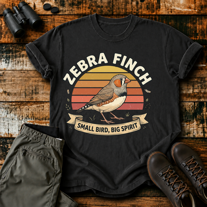 Zebra Finch Small Bird Big Spirit Tee in Black, centered front design on a birdwatching flat-lay mockup