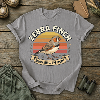 Zebra Finch Small Bird Big Spirit Tee in Grey, centered front design on a birdwatching flat-lay mockup